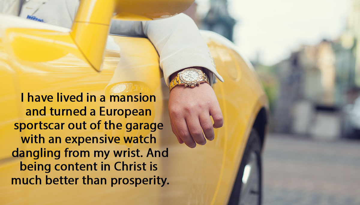 Closeup of man hand with golden watch in car